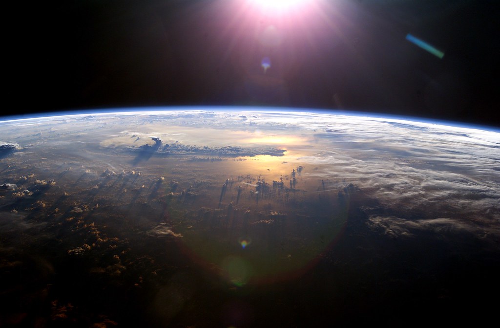 Earth as seen from space consisting of the Pacific Ocean and cloud coverage